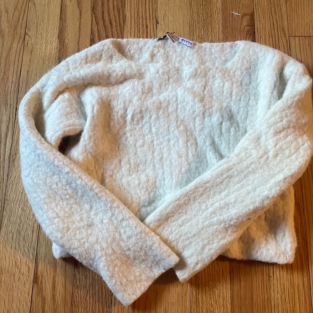 this is a white sweat shirt that is very fuzzy.